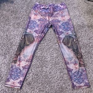 Capri length yoga pants. Stretchy, not see through, mainly purple themes.